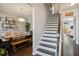 Inviting hallway with a staircase and dining room view, showcasing the home's layout and design at 106 Mesquite Dr, Durham, NC 27703