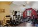Well-equipped home gym featuring various exercise machines, weights, and a durable rubber floor at 106 Mesquite Dr, Durham, NC 27703
