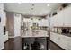 Well-lit kitchen featuring stainless steel appliances, a center island with seating, and ample storage at 106 Mesquite Dr, Durham, NC 27703