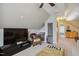 Relaxing living room under vaulted ceiling, complete with large TV and comfy seating area at 106 Mesquite Dr, Durham, NC 27703