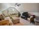 A cozy living area with neutral walls, ceiling fan and comfortable furnishings at 106 Mesquite Dr, Durham, NC 27703