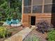 Charming outdoor patio area with stone pavers, a birdbath and seating with Adirondack chairs at 106 Mesquite Dr, Durham, NC 27703