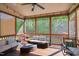 Comfortable screened-in porch featuring nice outdoor seating and fan to enjoy outdoors bug free at 106 Mesquite Dr, Durham, NC 27703