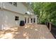 Expansive back deck, perfect for outdoor gatherings, with wooded backdrop and space for grilling at 108 Westport Dr, Cary, NC 27511