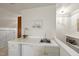 Built-in bar featuring a countertop, mini fridge, and shelving at 108 Westport Dr, Cary, NC 27511