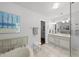 Bathroom featuring a jetted tub, a vanity with double sinks, and neutral wall color at 108 Westport Dr, Cary, NC 27511