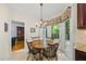 Cozy dining area features wood table and chairs next to a sunlit outdoor view at 108 Westport Dr, Cary, NC 27511