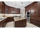 Spacious kitchen features stainless steel appliances, a center island, and dark wood cabinets at 108 Westport Dr, Cary, NC 27511