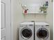 Well-equipped laundry room featuring a washer and dryer at 108 Westport Dr, Cary, NC 27511