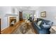 Cozy living room with a fireplace, wood floors, and ample natural light at 108 Westport Dr, Cary, NC 27511