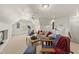 Living area with comfortable seating, exercise equipment, and a small bar area at 108 Westport Dr, Cary, NC 27511