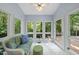 Sunroom featuring comfortable seating and an exterior access door to a deck at 108 Westport Dr, Cary, NC 27511