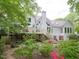 Expansive backyard view showcasing a deck and lush garden at 110 Blackford Ct, Durham, NC 27712