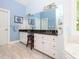 The bathroom features double sink vanity, large mirror, and soaking tub beneath a window at 110 Blackford Ct, Durham, NC 27712