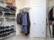 This walk-in closet provides ample storage space with shelving and racks for clothes and shoes at 110 Blackford Ct, Durham, NC 27712