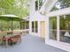 Covered deck with dining table and umbrella, exterior view of house at 110 Blackford Ct, Durham, NC 27712