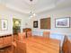 Dining room with wood table, stylish light fixture, and view into the kitchen at 110 Blackford Ct, Durham, NC 27712