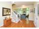 Inviting foyer features hardwood floors and a staircase leading to the living area at 110 Blackford Ct, Durham, NC 27712