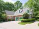 Large brick house with a two-car garage and a long driveway at 110 Blackford Ct, Durham, NC 27712