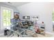 Modern home office featuring a glass desk and an abundance of natural light at 110 Blackford Ct, Durham, NC 27712