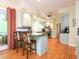 Charming kitchen with breakfast bar seating, modern appliances, and hardwood floors at 110 Blackford Ct, Durham, NC 27712