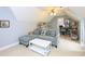 Comfortable living room area with a blue sofa and a white coffee table at 110 Blackford Ct, Durham, NC 27712