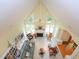 Expansive living room with vaulted ceiling, fireplace, built-in shelves, and ample natural light at 110 Blackford Ct, Durham, NC 27712