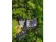 Home's roof surrounded by lush greenery, showing its place among nature at 1166 Nc Highway 87 N, Pittsboro, NC 27312