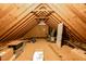 Unfinished attic with exposed beams and rafters showing potential for storage or expansion at 1166 Nc Highway 87 N, Pittsboro, NC 27312