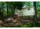 Private backyard oasis with a fire pit, string lights, a hammock and a wooden fence at 1166 Nc Highway 87 N, Pittsboro, NC 27312