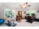 Bedroom with wooden wardrobe, a ceiling fan, and carpeted floors at 1166 Nc Highway 87 N, Pittsboro, NC 27312
