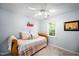 Bedroom with daybed, decorative pillows, ceiling fan, and natural light from the window at 1166 Nc Highway 87 N, Pittsboro, NC 27312