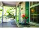 Charming front porch with a potted plant and green shutters enhancing the curb appeal at 1166 Nc Highway 87 N, Pittsboro, NC 27312