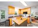Spacious kitchen with stainless appliances, wood cabinets, and a butcher block island at 1166 Nc Highway 87 N, Pittsboro, NC 27312