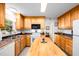 Well-lit kitchen showcasing ample counter space, stainless steel appliances, and generous cabinet storage at 1166 Nc Highway 87 N, Pittsboro, NC 27312