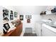 Bright laundry room featuring front load washer and dryer and dog-themed decor at 1166 Nc Highway 87 N, Pittsboro, NC 27312