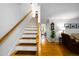 Bright staircase with hardwood railings and treads, leading to the upper level at 1166 Nc Highway 87 N, Pittsboro, NC 27312