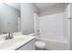 Bathroom with vanity, toilet, and a tub with shower head at 120 Shore Pine Dr, Youngsville, NC 27596