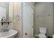Cozy bathroom with toilet, sink, mirror and towel rack at 120 Shore Pine Dr, Youngsville, NC 27596