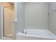 Bright bathroom featuring a bathtub and a glass-enclosed shower at 120 Shore Pine Dr, Youngsville, NC 27596
