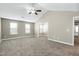 Expansive bedroom featuring vaulted ceiling, fan, neutral carpet, and lots of natural light at 120 Shore Pine Dr, Youngsville, NC 27596