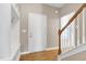 Foyer with hardwood floors, hall tree, and staircase leading to the upper level at 120 Shore Pine Dr, Youngsville, NC 27596