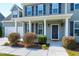 Inviting front porch with classic white columns, providing a welcoming entrance to the home at 120 Shore Pine Dr, Youngsville, NC 27596
