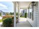 Covered front porch with views of the neighborhood, offering a relaxing outdoor space at 120 Shore Pine Dr, Youngsville, NC 27596
