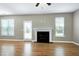 Bright living room with hardwood floors, fireplace, and natural light at 120 Shore Pine Dr, Youngsville, NC 27596