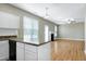 Open-concept living space with kitchen island, fireplace, and lots of natural light at 120 Shore Pine Dr, Youngsville, NC 27596