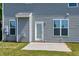 View of the backyard and patio of this home with neutral siding at 120 Shore Pine Dr, Youngsville, NC 27596
