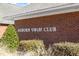 Exterior shot of the Auburn Swim Club with clear signage amidst manicured landscaping at 1208 Copper Creek Dr, Durham, NC 27713