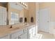 Bathroom featuring double sinks, large mirror, and plenty of counter space at 1208 Copper Creek Dr, Durham, NC 27713