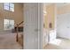 Bathroom near staircase featuring natural light, granite counters and white cabinets at 1208 Copper Creek Dr, Durham, NC 27713